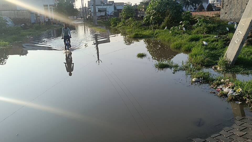 Main street of Dalamwala turns into a pond; villagers distressed by knee-deep, filthy water.