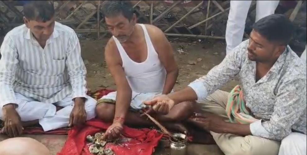 Ram Govind Chaudhary's urn containing ashes immersed at the Sangam banks in Prayagraj.