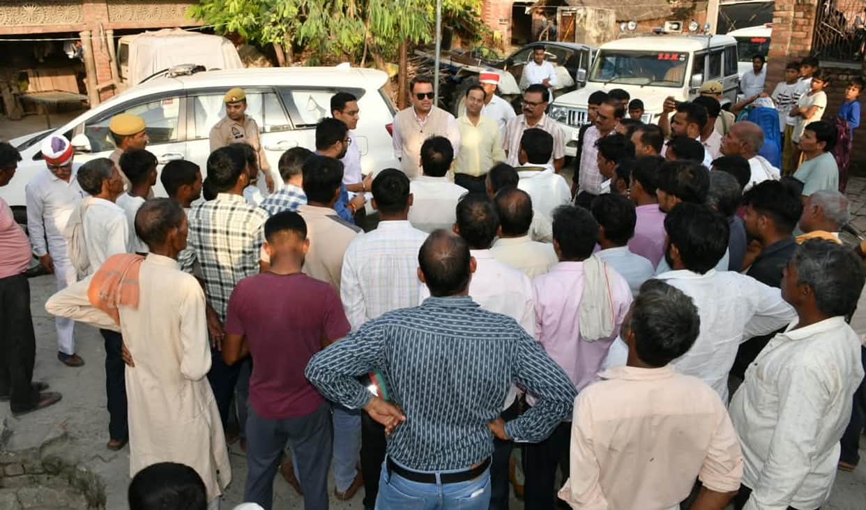 DM reaches flood-hit village by boat; takes stock of arrangements.