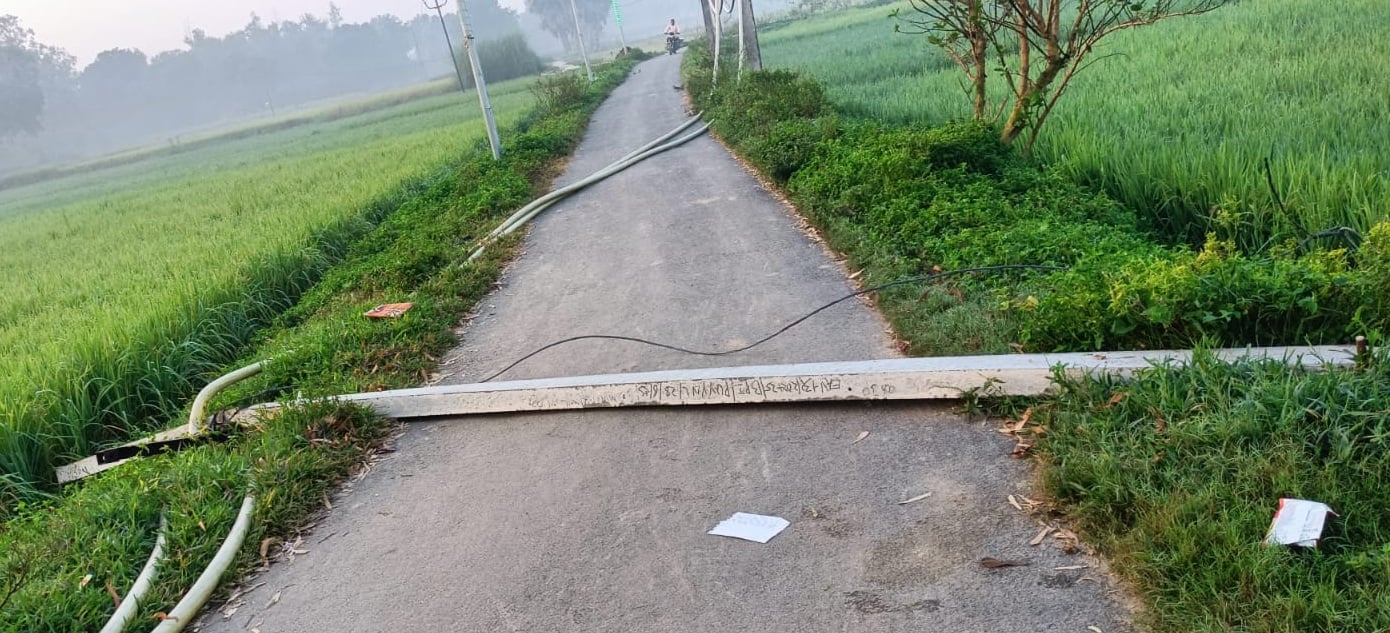 Two high-tension line poles collapsed; people had a narrow escape.