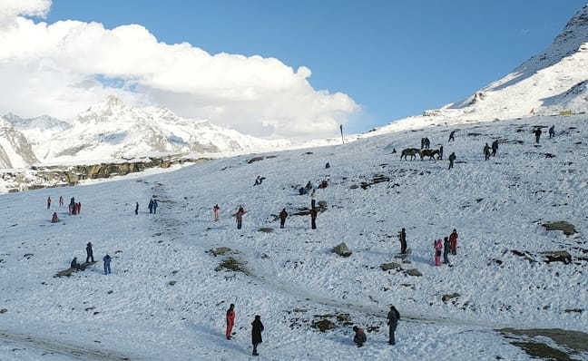 Tourists admiring the valleys while paragliding