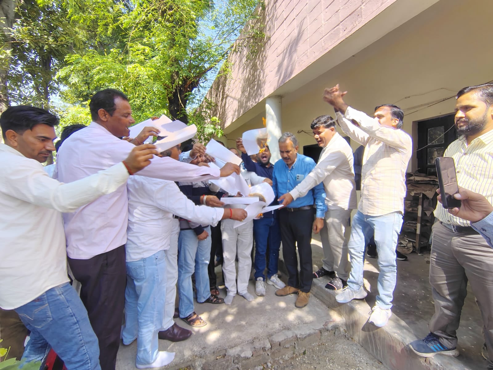 Electricity department employees staged a protest and burned copies of the policies.