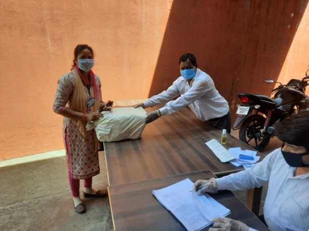 Handling bundles to teachers for checking answer books of class