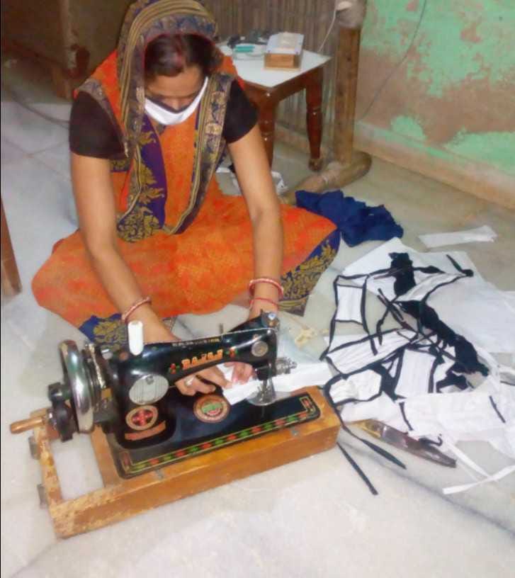 naugaon jiwan education centre associate woman make mask
