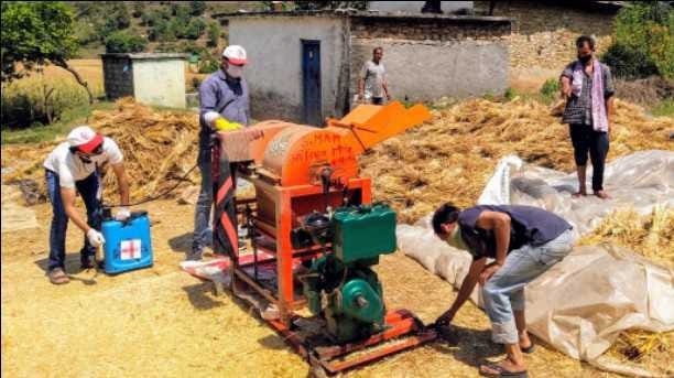 Red Cross Society sanitizes thresher