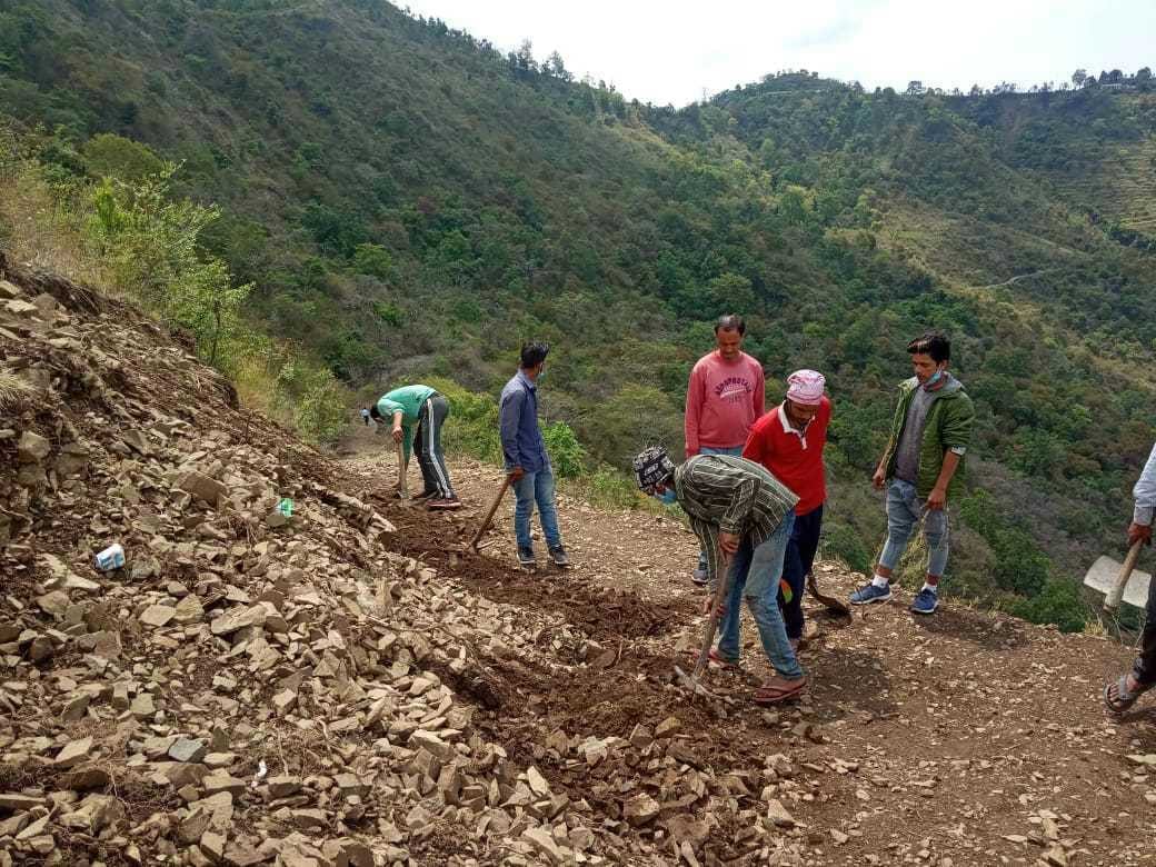 Villagers engaged in road construction under lockdown