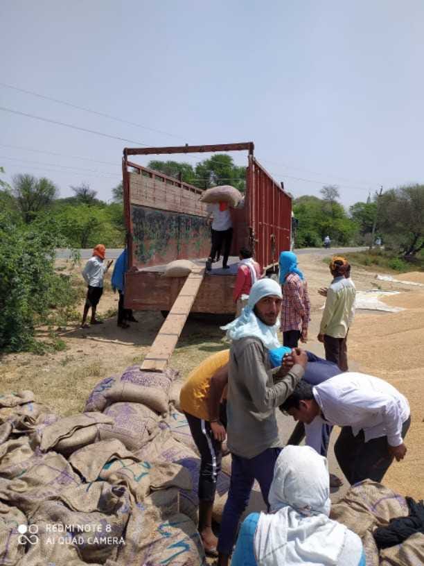 Wheat-filled sacks continue to be lifted from the grain market of Narwana