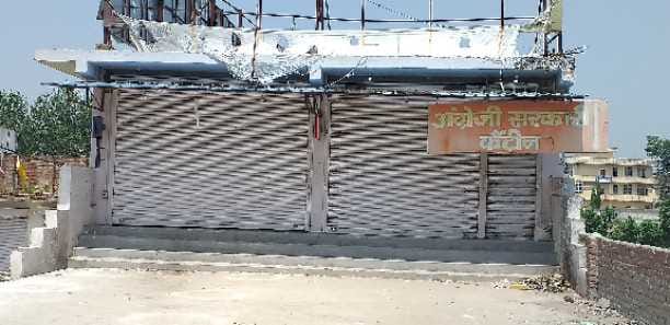 Impact of symbolic liquor shop closure, locks hanging on shops