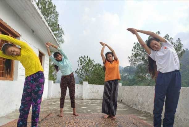 Doing yoga at home, informing neighbors about the benefits of yoga.