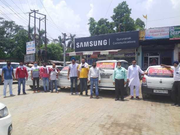 Youths of Rudrapur protest against dragons by putting anti-China stickers on vehicles