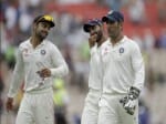 dhoni and kohli smiling at test