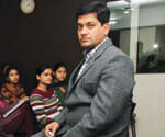 success story of a man who do job of peon now owner of software company