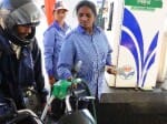women's working on petrol pump