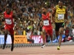Bolt trumps Gatlin to retain world 100m title