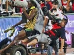 Usain Bolt knocked down in Beijing by cameraman