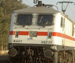 truck stuck at railway crossing, trains stop