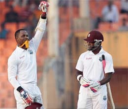 samuels blasts double century as bangladesh toil