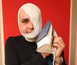 man picks up iron instead of telephone