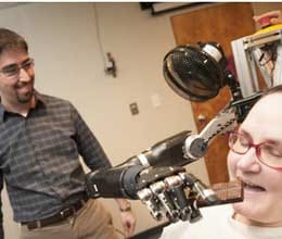  paralyzed woman moves prosthetic arm with her brain