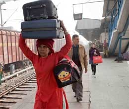 widow forced to carry luggage on station for a living 