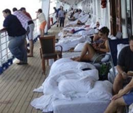 crippled cruise ship returns passengers happy to be back