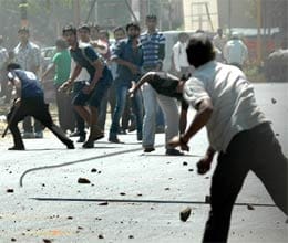 fracas in allahabad university for free laptops