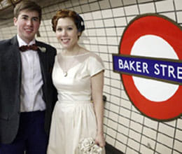 newlywed couple hop on the Tube to reception venue
