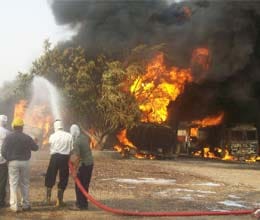 fire near refinery four tanker burns