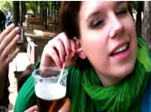 girl drinks beer with her ear