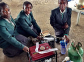 African girls makes urine powered generator