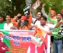 modi protesters demonstrate outside advani's residence