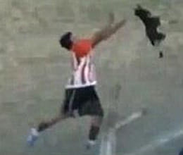 dog held and thrown in air in football club math in argentine