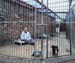 man prepares to live like a dog