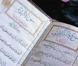 visually impaired student memorises quran through braille