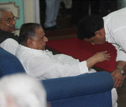 mla in race to touch the feet of mulayam