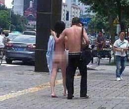 fighting couple strip naked in   public