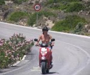 woman arrested after driving topless on her motorcycle