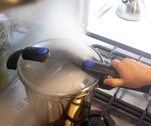 Bright explosion cracked cooker, female scorched