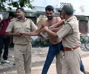 family blames raja bhaiya, tries to set self ablaze