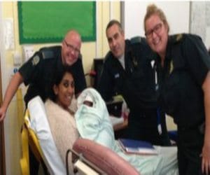 teacher gives born child in classroom