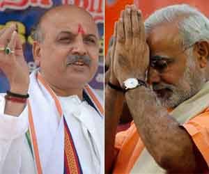 praveen togadiya raises question on narendra modi.