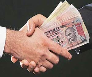 39 IAS and 7 IPS in corruption charge