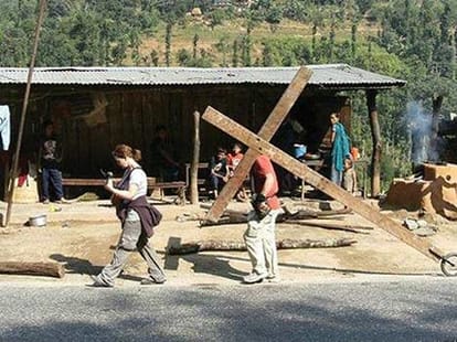 man_carries_cross_