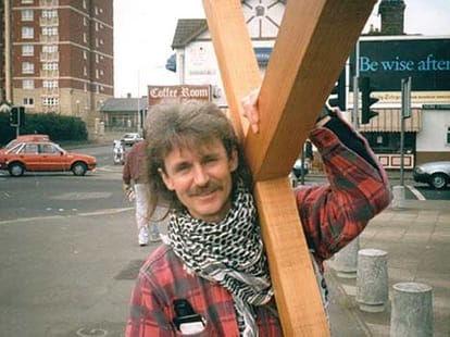 man_carries_cross_