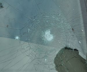 For asking side on road, they thrashed the car glass