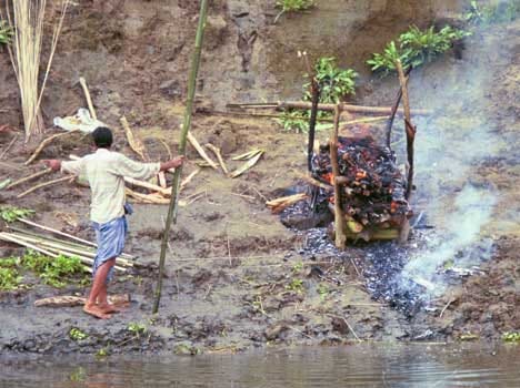 before cremation dead body flow in heavy rain 