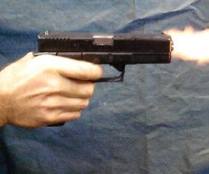 firing by auto passanger, one killed
