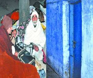 Patients sleep in open ground, while public houses loacked