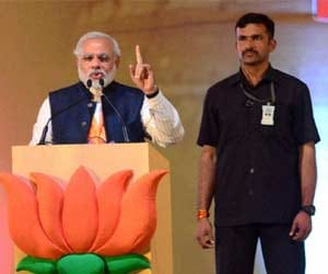 Modi addressing an election rally at Ramlila Ground.