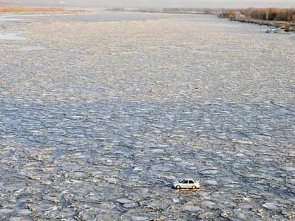 car driving on river